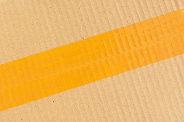 scotch tape stick wrapping on brown carton paper box package of industrial, image used for design...
