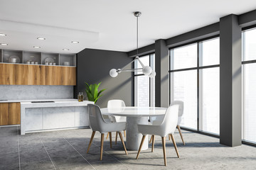 Panoramic grey and wood kitchen corner with table