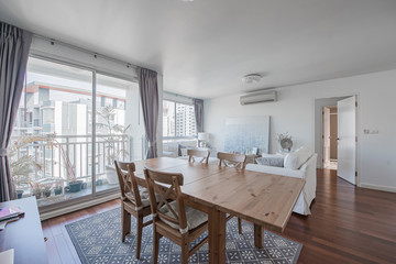 Stylish kitchen interior with dining table and chairs