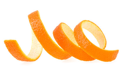 Spiral form of orange skin isolated on a white background. Orange zest.