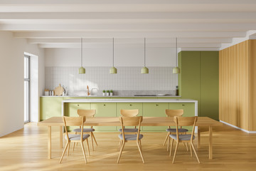 White and green kitchen interior with table