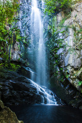Fototapeta na wymiar great waterfall in the middle of a spectacular forest and granite rock in Galicia, Spain. Augacaida waterfall, in the Ribeira Sacra of the Miño river