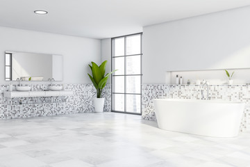 White mosaic bathroom, tub and double sink