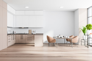 White and beige kitchen with table