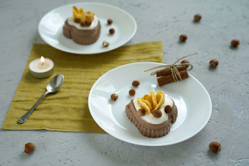 chocolate cake with nuts on table