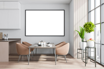 White and wooden dining room interior with poster