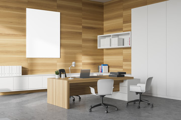 White and wood CEO office corner with poster
