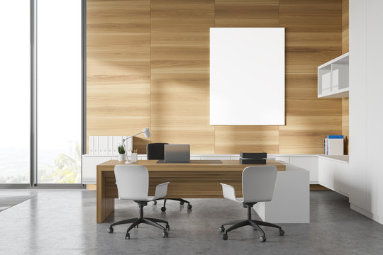 White and wood CEO office with poster