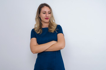 Closeup portrait displeased pissed off angry grumpy pessimistic woman with bad attitude, arms crossed looking sideways. Negative human emotion facial expression feelings