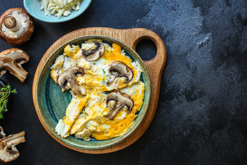 scramble fried eggs
omelet with mushrooms
Menu concept healthy eating. food background top view copy space for text
keto or paleo organic product diet