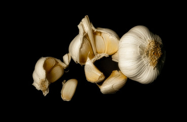 Isolated on black garlics