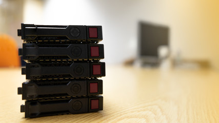 Front side of server harddisk old on brown wooden table.
