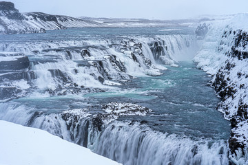 Fototapeta premium Gulfoss in Icelands Interior, snow covered waterfalls.