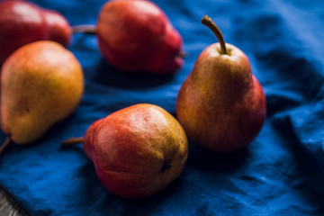 Fresh and ripe sliced pears on the rustic background. Selective focus. Shallow depth of field.