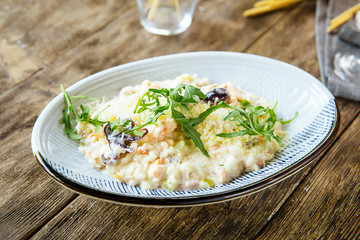 Gourmet seafood white salad with octopus shrimps