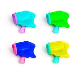 A set of four colorful pink and blue popper party confetti bullet gun, isolated on white.