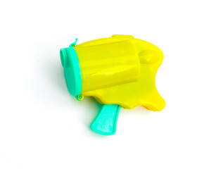 A yellow and marine color popper party confetti bullet gun, isolated on white.