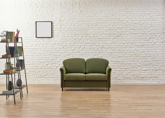 White brick wall green sofa and frame living room.