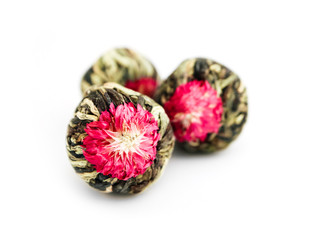 Three bound Asian tea ball with violet flower, isolated on white background.