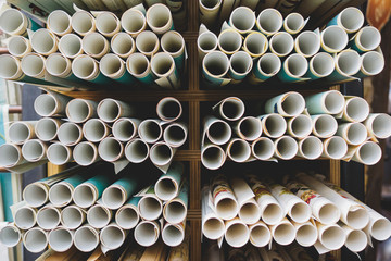 Vintage rolled geographic maps in Spitalfield Market (London). Travel concept. Landscape format.