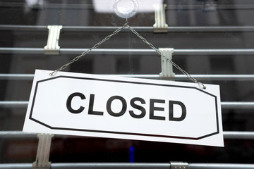 closed sign at entrance of a shop