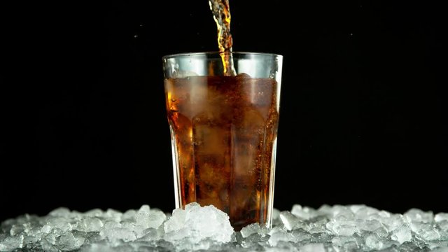 Super slow motion of pouring cola into glass. Filmed on high speed cinema camera, 1000fps.