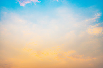 Beautiful sky with cloud before sunset. Colorful sky in twilight background. Bright Blue, Orange And Yellow Colors Sunset.