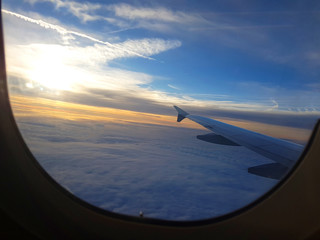 view from airplane window with beaufiful sky in the morning