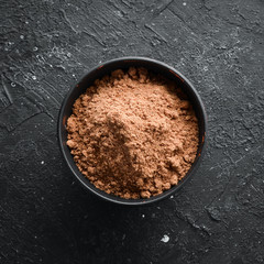 Spices. Nutmeg in a bowl. Free space for your text. Top view.
