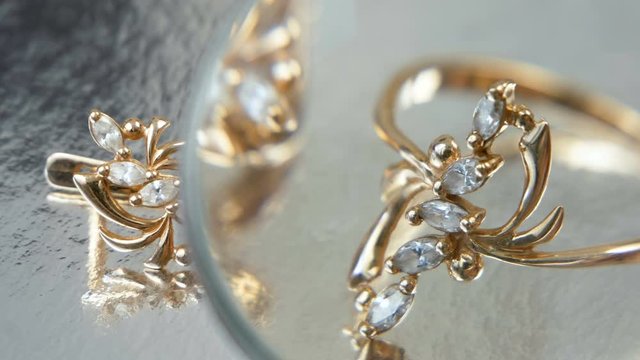 jeweler looking at jewelry through magnifying glass, jewerly inspect and verify, pawnshop concept, jewerly shop concept