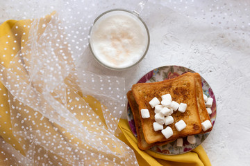 French bread toast. French bread toast with marshmallows and coffee
top view