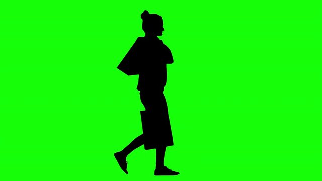 Woman Walking Back From a Successful Shopping Trip Green Screen Silhouette