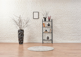 White brick wall and grey bookshelf vase of plant black concept.