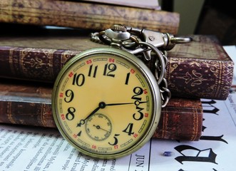 old pocket watch and book