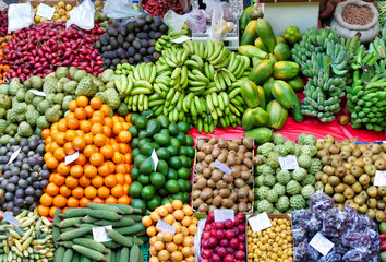 A variety of fruit and vegetables in an open air market market on the island of Madeira