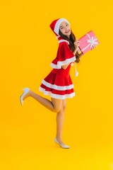 Portrait beautiful young asian christmas clothes and hat smile happy with red gift box