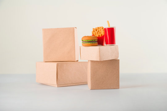 Sales of products.  A lot of boxes on a white background close-up and copy space. Fast food. The concept commerce, online shopping. Purchasing power, delivery order. E-commerce, sales and sale of good