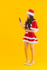 Portrait beautiful young asian woman wear christmas clothes and hat use mobile phone