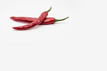 Two Chili peppers isolated on white background. Hot ripen chili peppers without GMO. Organic...