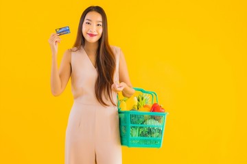 Portrait beautiful young asian woman with grocery basket shopping bag