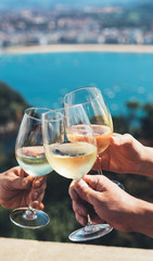Drink three glasses white wine in friends hands outdoor seascape holidays, romantic couple toast...