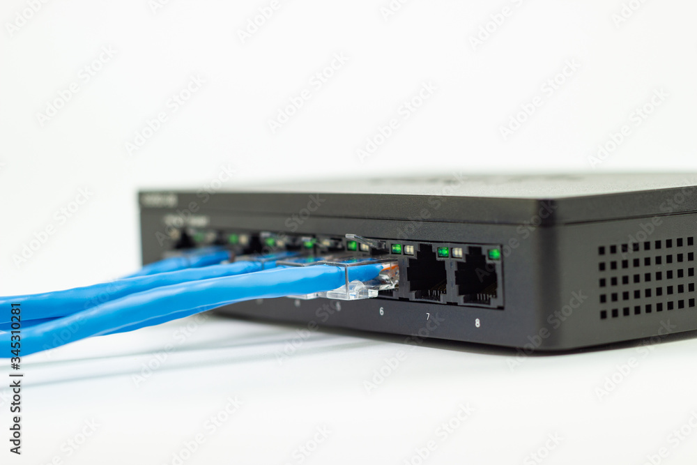 Poster the blue network cables connect port switch on white table concept internet network connection