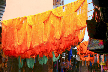 Fototapeta premium Marrakesh street scene, dyed clothes being dried 