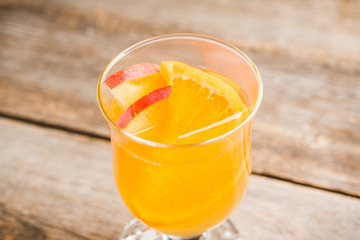 Healthy hot beverage with oranges, apples and spices for protection in flu season. Selective focus. Shallow depth of field.