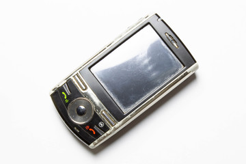 Old cell phone on white background