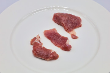 Meat, pork, slices pork loin on a white background

