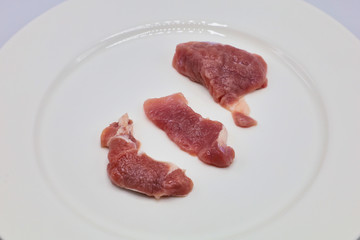 Meat, pork, slices pork loin on a white background
