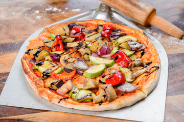 pizza with mushrooms and cheese vegan colorfull on  the wood table oven peel paddle