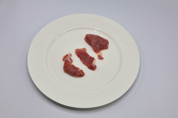 Meat, pork, slices pork loin on a white background
