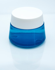 blue jar with a lid with cream